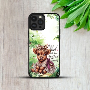 May include: Black phone case with a brown Highland cow illustration wearing a bow and dress. The case has the text "Just A Girl Who Loves Highland Cows". The background includes green foliage and a bird.