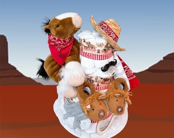 May include: A diaper cake decorated with a cowboy theme. The cake is topped with a stuffed horse wearing a red bandana, a cowboy hat, and a pair of brown booties. The cake is decorated with red and white gingham ribbon, a brown and white cowboy print, and a brown mustache.
