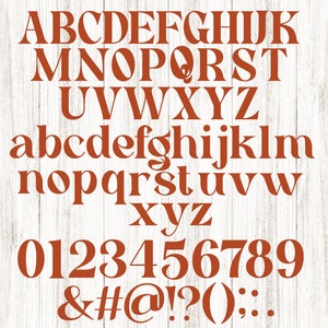 May include: A complete alphabet and number set in a serif font, displayed in a warm, reddish-brown color. The letters, numbers, and symbols are arranged on a white, wood-grain background, ideal for design projects.