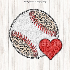 May include: A white baseball with red stitching and a leopard print design. A red heart with stitching is next to the baseball.