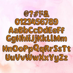 May include: Gold glitter alphabet with uppercase letters, lowercase letters, numbers 0-9, and symbols @, ?, #, !, and &. The letters and numbers are outlined in black.