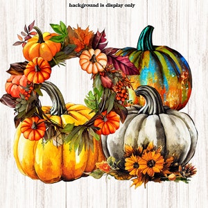 May include: A fall-themed wreath featuring three pumpkins. The wreath is made of autumn leaves, berries, and flowers. The pumpkins are orange, white, and blue with a green stem. The background is a white woodgrain.