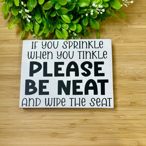 If you sprinkle when you tinkle, please be neat and wipe the seat wooden bathroom sign