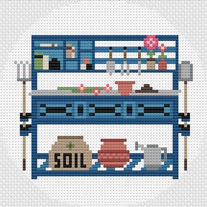 May include: A blue wooden garden potting bench with two shelves. The top shelf has a variety of gardening tools, including a trowel, a rake, and a pair of shears. The bottom shelf has a bag of soil, a terracotta pot, and a watering can. There are also two small potted plants with pink flowers on the top shelf.