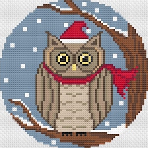May include: A brown owl wearing a red Santa hat and scarf, perched on a branch in a snowy winter scene.