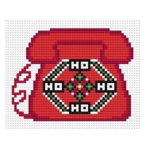 May include: A cross-stitch design of a red rotary phone with a white cord. The phone's center features a diamond pattern with the letters "HO" and green and gold accents. The design is on a white background.