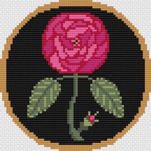 May include: A pink rose with green leaves and a bud, framed in a gold circle on a black background.