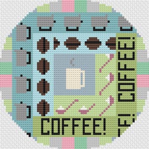 May include: A cross-stitch pattern featuring a coffee cup, coffee beans, and the text "COFFEE!" in a green, blue, and gray color scheme.
