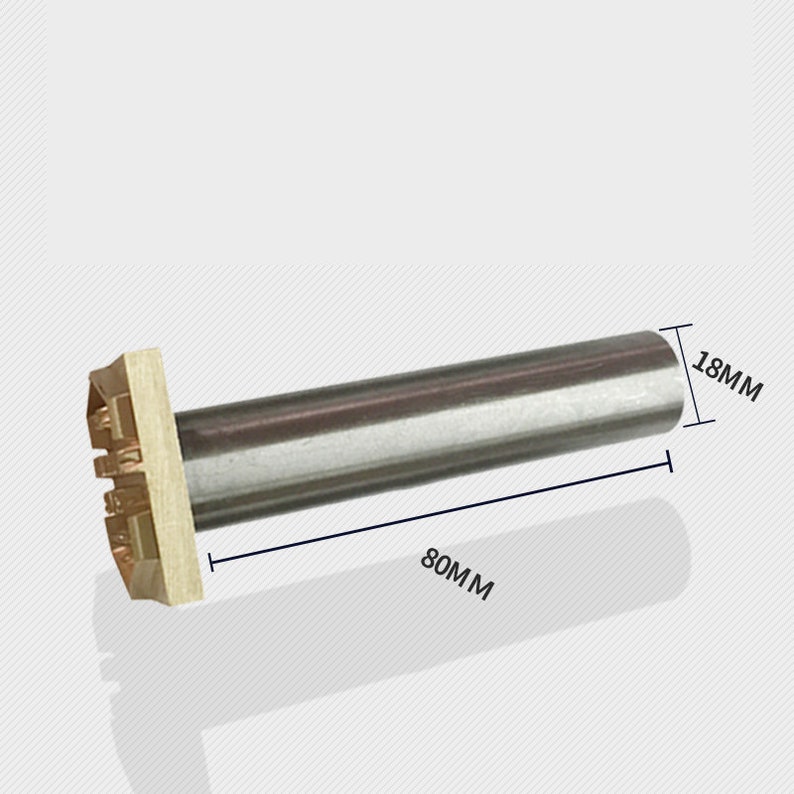 May include: A metal stamping tool with a brass head measuring 80mm long and 18mm wide.