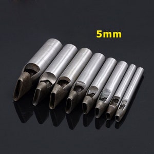 May include: Set of eight metal leather hole punch tools, ranging in size from small to large. The tools are silver in color and have a rounded, oval-shaped hole punch. The largest punch is labeled "5mm".