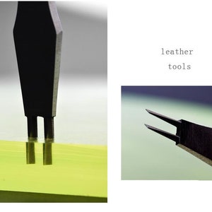 May include: Close-up of a black leather tool with two prongs. The tool is being used to punch holes in a piece of yellow leather.  leather tools