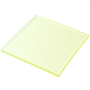 May include: A translucent yellow square sheet of acrylic plastic.