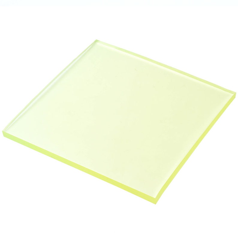 May include: A translucent yellow square sheet of acrylic plastic.