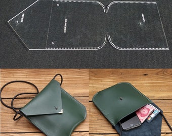 May include: A green leather crossbody bag with a flap closure and a silver metal accent. The bag is shown with a phone and cash inside.