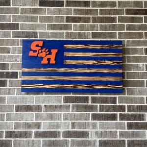 Sam Houston State University (SHSU) burnt wood flag