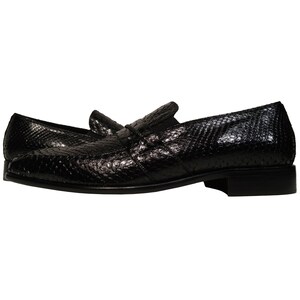 May include: Black leather loafers with a snakeskin pattern.