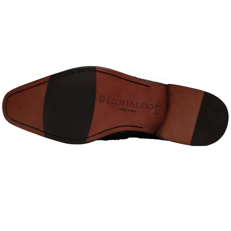 May include: The bottom of a black leather shoe with a brown leather sole. The sole is labeled "RONALDO MADE IN ITALY" and "9 1/2 M".