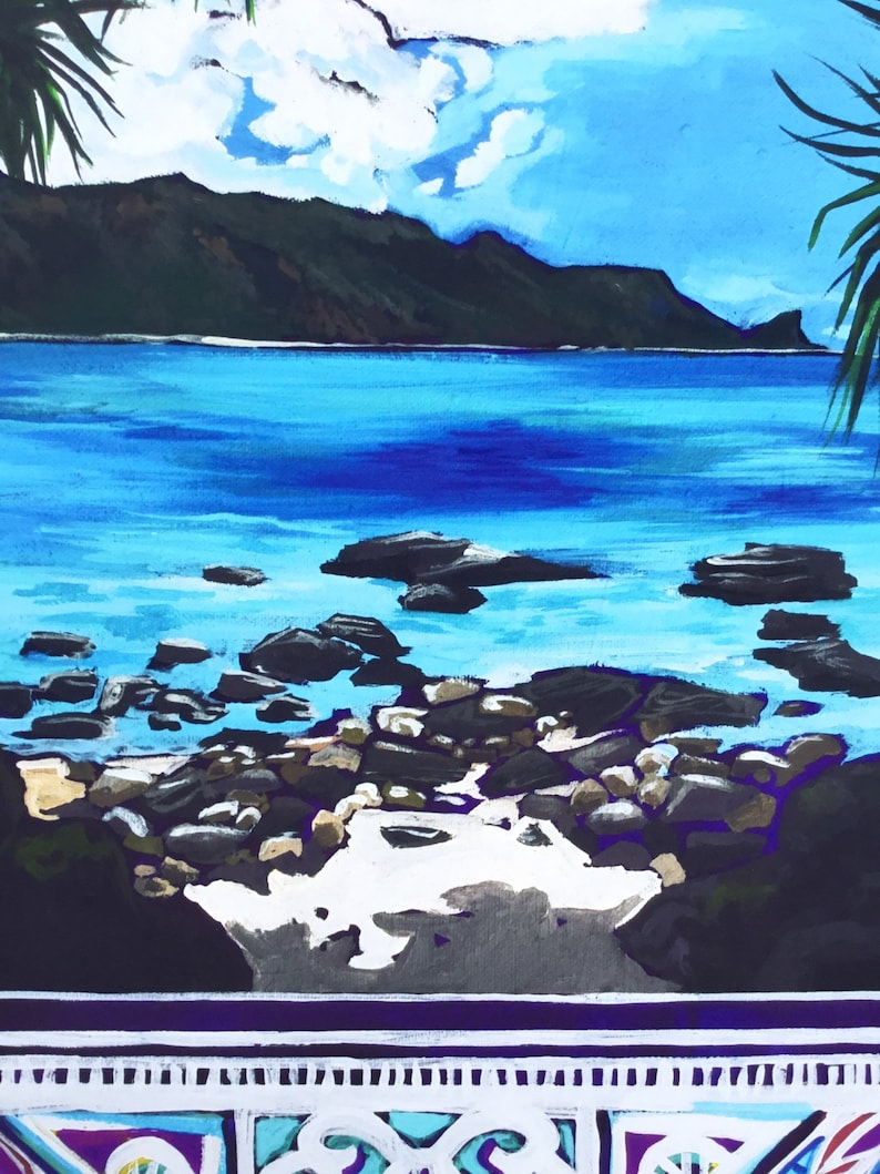 May include: A painting of a tropical beach scene with a mountain range in the background. The water is a vibrant blue and there are rocks in the foreground. The sky is a light blue with white clouds.