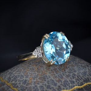Blue Topaz and Diamond Oval Solitaire 9ct Yellow Gold Ring