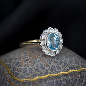 Blue Topaz and Diamond Oval Halo Cluster 9ct Yellow Gold Ring
