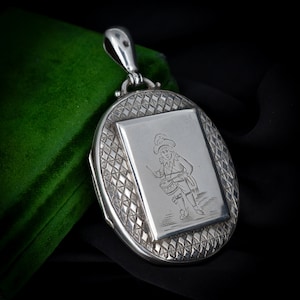Antique &#39;Little Drummer Boy&#39; Sterling Silver Oval Engraved Photo Locket Pendant