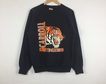 Sudadera vintage de los 90 de los Carroll Tigers con logo grande, estilo universitario estadounidense, marca Hanes, estilo jersey gráfico, talla M para hombre, color negro.