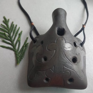 Ceramic pendant ocarina necklace. Hand decorated clay flute jewelry.