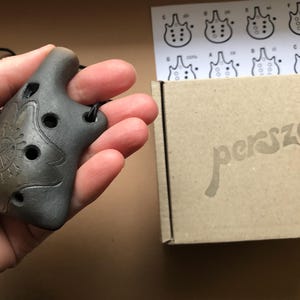 Ceramic pendant ocarina necklace. Hand decorated clay flute jewelry.