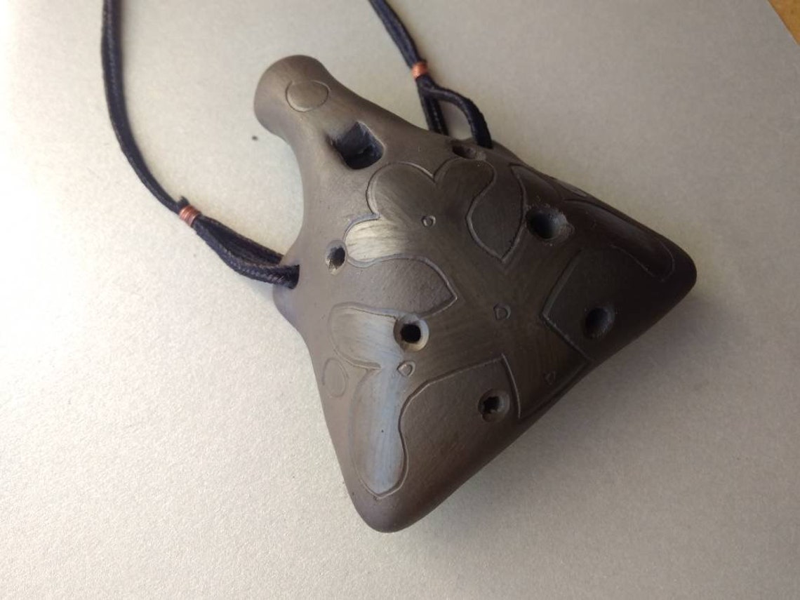 Handmade ceramic ocarina with medieval ornament. Black clay Etsy