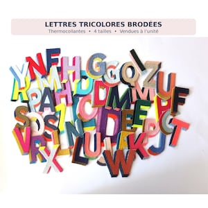 May include: A collection of embroidered, iron-on alphabet letters in various tricolor combinations. The letters feature bold, layered designs with contrasting edges. The text at the top reads: LETTRES TRICOLORES BRODÉES, Thermocollantes, 4 tailles, Vendues à l'unité.