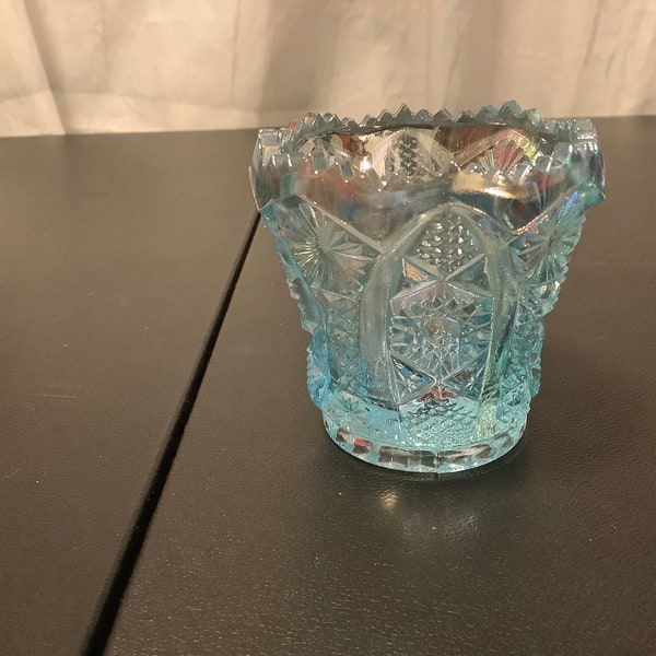 Ice Blue Carnival Glass iridescent Toothpick Holder. Measures 2.75” tall.