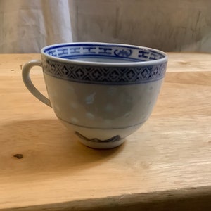 Vintage Chinese, blue white, porcelain rice, eye grain cup. made in China