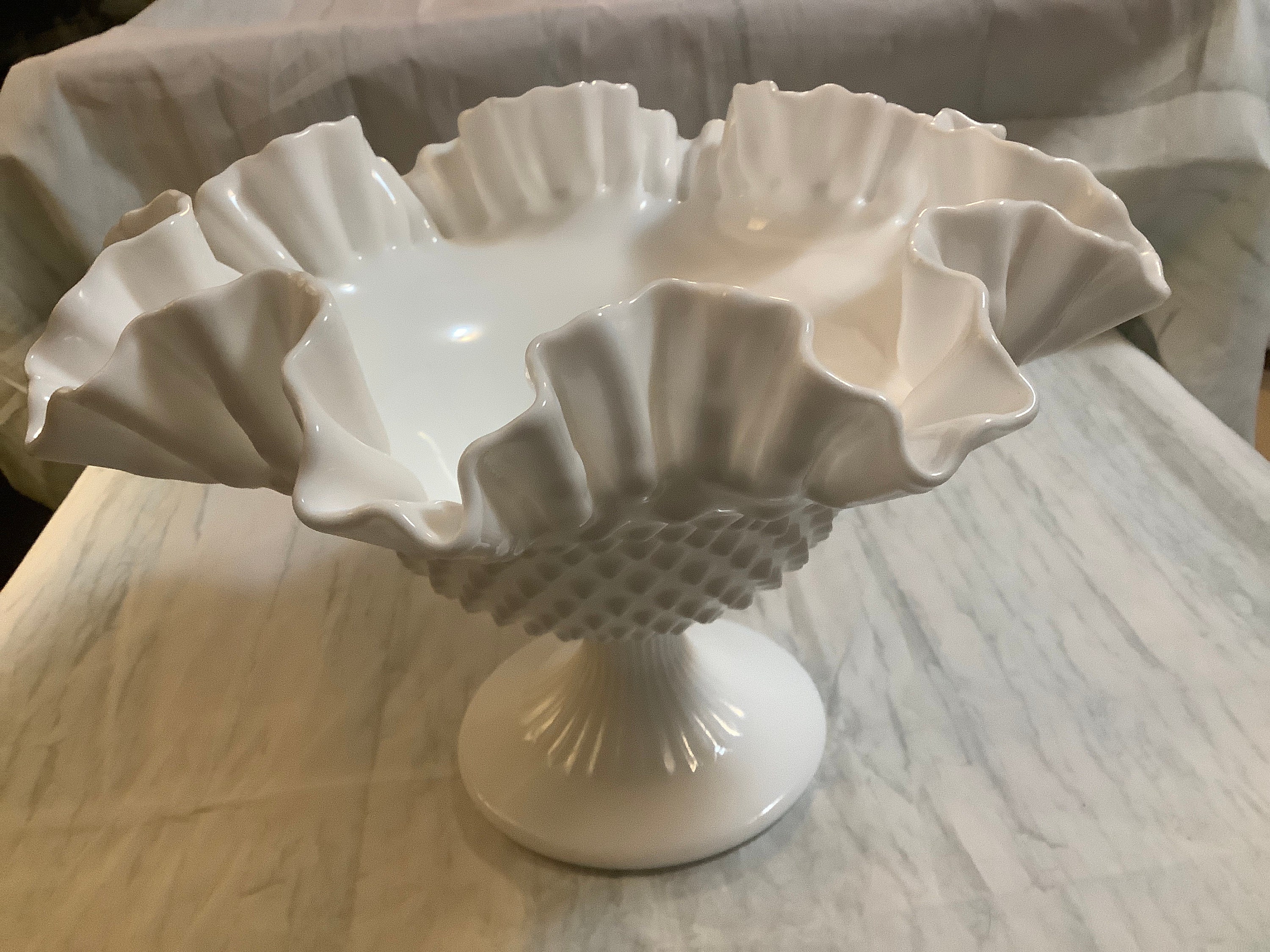 Milk glass hobnail, compote. 6 1/2 inches tall and 10 inches in diameter