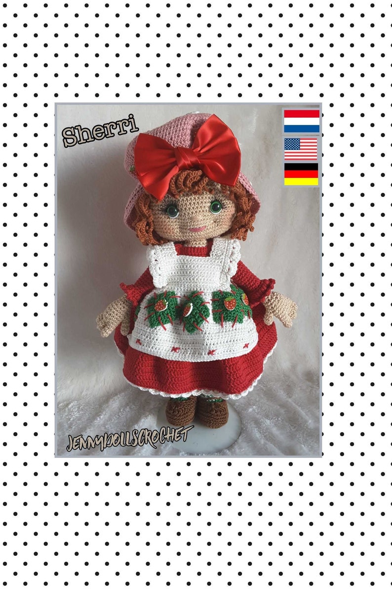 May include: A crocheted doll named "Sherri" wearing a red dress with a white apron and a pink hat with a red bow. The doll has brown hair and green eyes. The doll is standing on a white surface. The image also includes the text "Jennydoolscrochet" and flags of the Netherlands, the United States, and Germany.