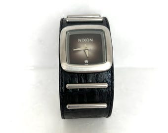 Nixon The Duchess Quartz Women's Watch, Royal Pleasure The Duchess 30M Stainless Steel, Swiss Parts, Wide Black Leather and Stainless Strap