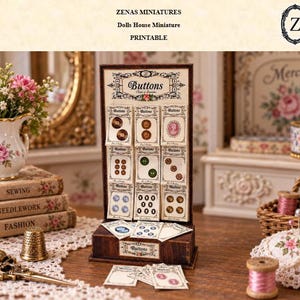 May include: A miniature wooden display stand for a dollhouse featuring nine cards of assorted small buttons, with the text "Buttons" printed at the top and base. The display includes additional loose button cards resting on the base in front of the stand.