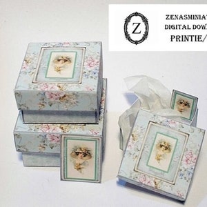 May include: Miniature decorative boxes and a tissue box with a vintage floral design. The boxes are light blue with pink and white flowers. Each box has a framed image of a woman in a hat.