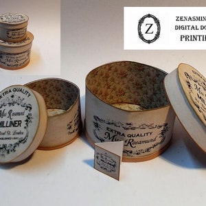 May include: Two vintage-style hat boxes with a floral pattern inside. The boxes are labeled "Extra Quality Miss Rosamund Milliner" and feature a black and white design.