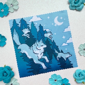 May include: A blue and white illustration of wolves running through a forest at night. The wolves are white with blue accents and the forest is a dark blue with white clouds. There is a crescent moon in the sky.