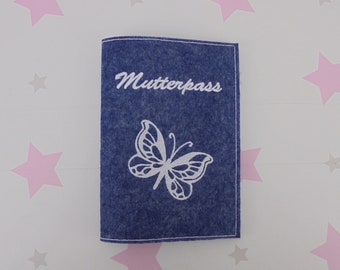 May include: A blue felt passport holder with white embroidery of a butterfly and the word "Mutterpass".