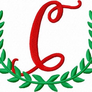 May include: A red cursive letter C surrounded by a green wreath of leaves.