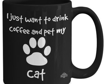 Cat coffee mug, black mug, "i just want to drink coffee and pet my cat" paw print image, gift for cat owner, available in two sizes.