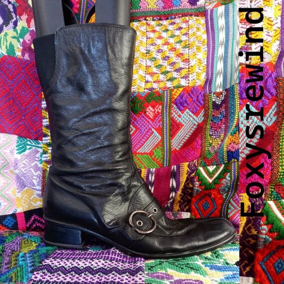 black boots silver buckles
