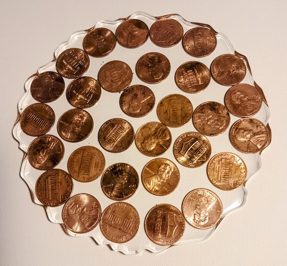 2 Clear Coasters with Various Pennies