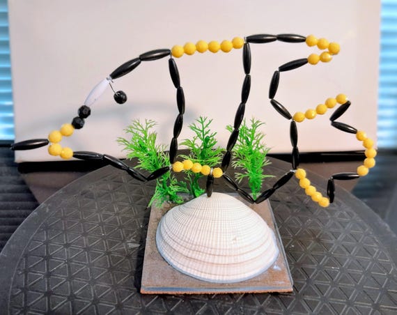 Seashell acrylic base with a wire beaded fish - an original table decoration