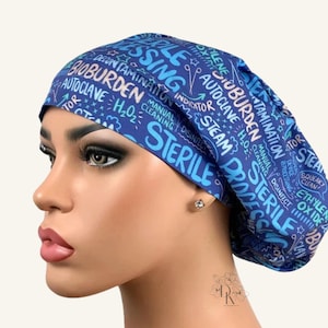 May include: A blue scrub cap featuring a repeating pattern of medical and sterilization-themed text including the words Sterile, Bioburden, Autoclave, Steam, and H2O2 in various shades of light blue, white, and dark blue lettering on a blue background.