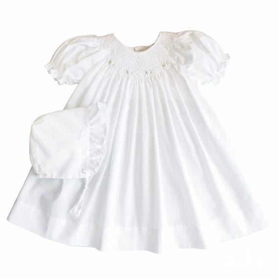 petit ami smocked dress Hand-Embroidered A classic bishop hand smocked dress with hand details give this classic dress a fresh look Blue Smocked LS Dress -