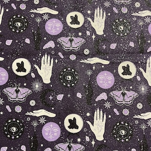 May include: A purple and black fabric with a repeating pattern of moths, moons, hands, and crystals. The background is a dark purple with a subtle sparkle.