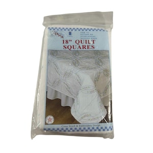 May include: A package of 18-inch quilt squares featuring an interlocking wedding rings pattern. The packaging displays the text 18" QUILT SQUARES, ITEM 732, PATTERN #20, INTERLOCKING WEDDING RINGS, and Cross Stitch & Embroidery Design on a white background.