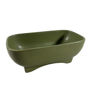 May include: A rectangular olive green ceramic bowl with rounded corners and a smooth matte finish. The bowl features a deep basin and is supported by four short, integrated feet at the base, elevating it slightly from the surface.